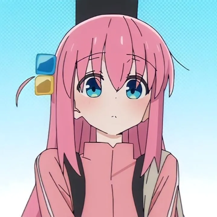 Anime PFP #33: Hitori Gotoh with long pink hair and blue and yellow cube clips stares blankly in her pink track jacket against a pale blue backdrop.