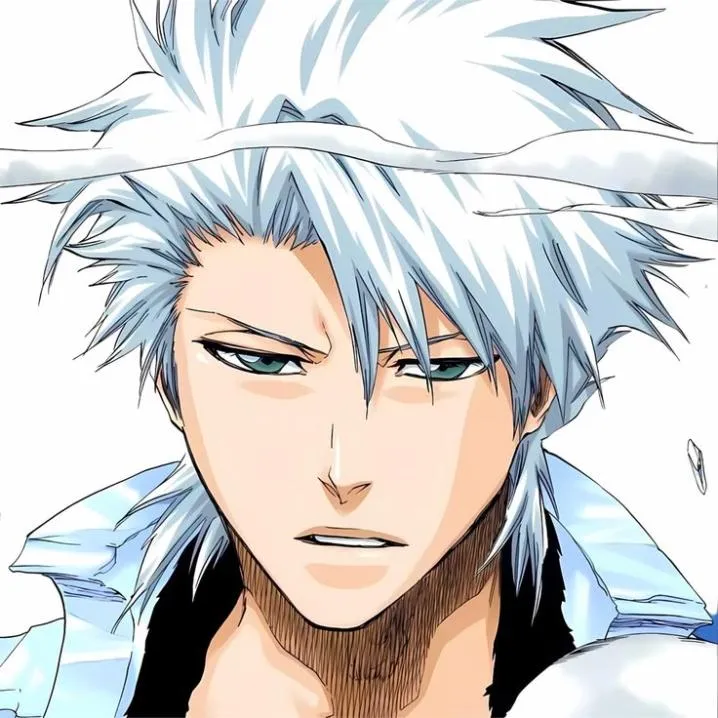 Bleach PFP #9: Toshiro with wild spiky white hair and teal eyes frowns slightly in a white jacket against a plain white background.
