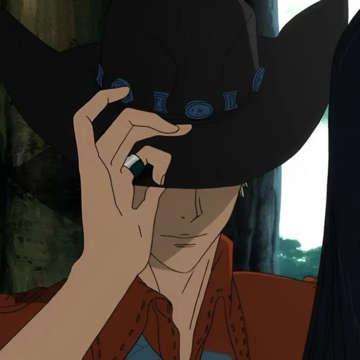 Cowboy PFP #12: An anime man in a red shirt tips a black cowboy hat with blue studs over his eyes, a silver ring on one finger.