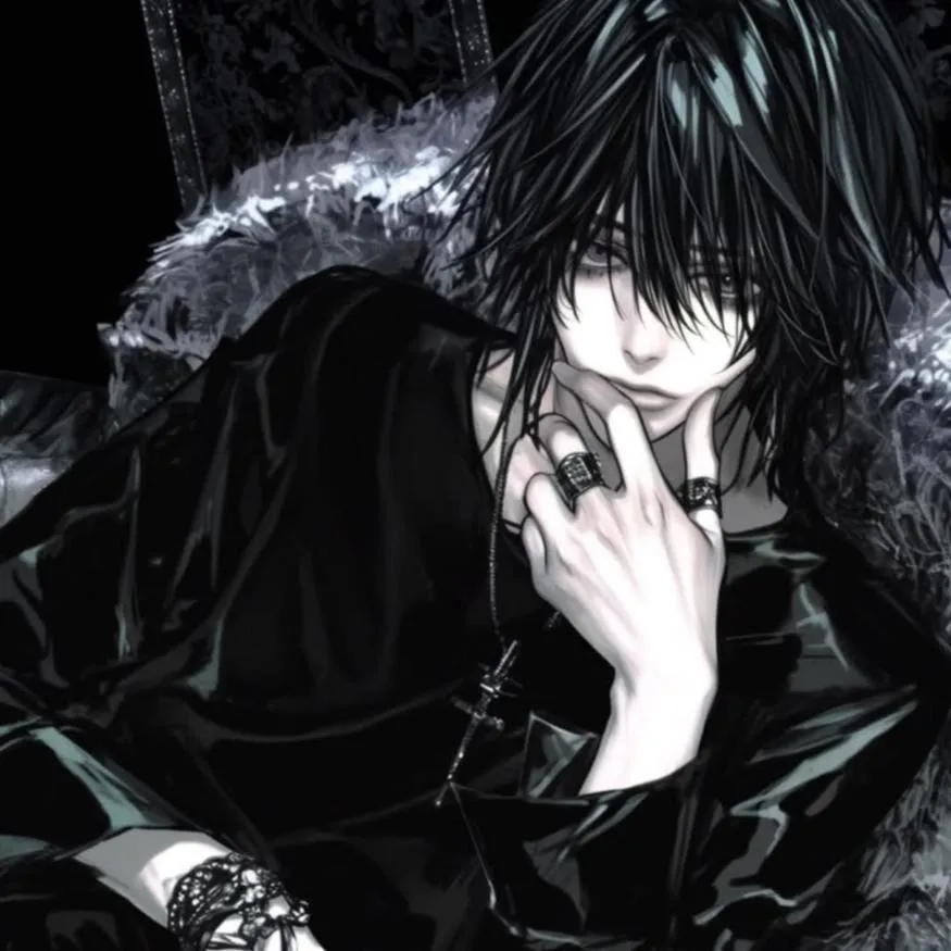 Emo PFP #17: A dark haired anime boy in black clothes lounges on a fur lined chair with silver rings, a cross necklace and a lace cuff.