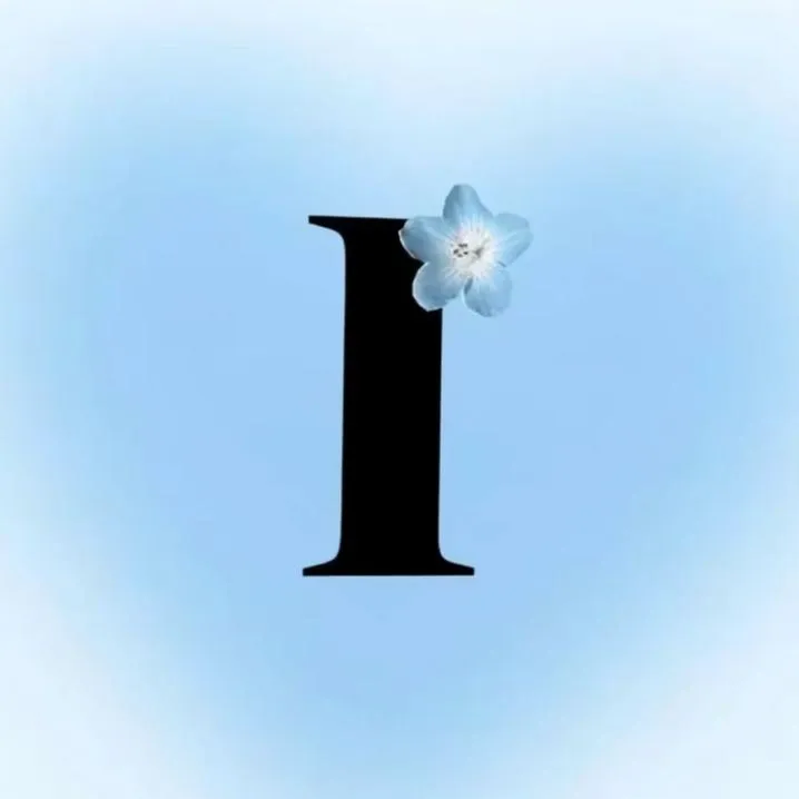 Letter PFP #110: A black serif letter I with a small pale blue flower on top sits on a soft blue glowing background.