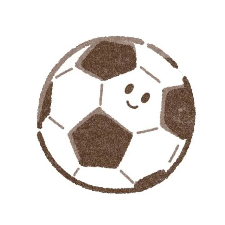 Soccer PFP #16: A hand drawn soccer ball with brown crayon patches and a tiny smiling face sits on a plain white background.